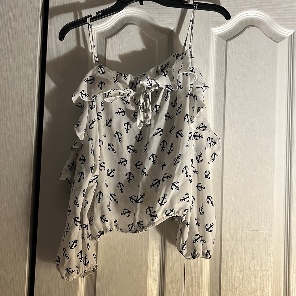 Women’s Liberty Love cold shoulder v neck blouse with ship anchor designs.
